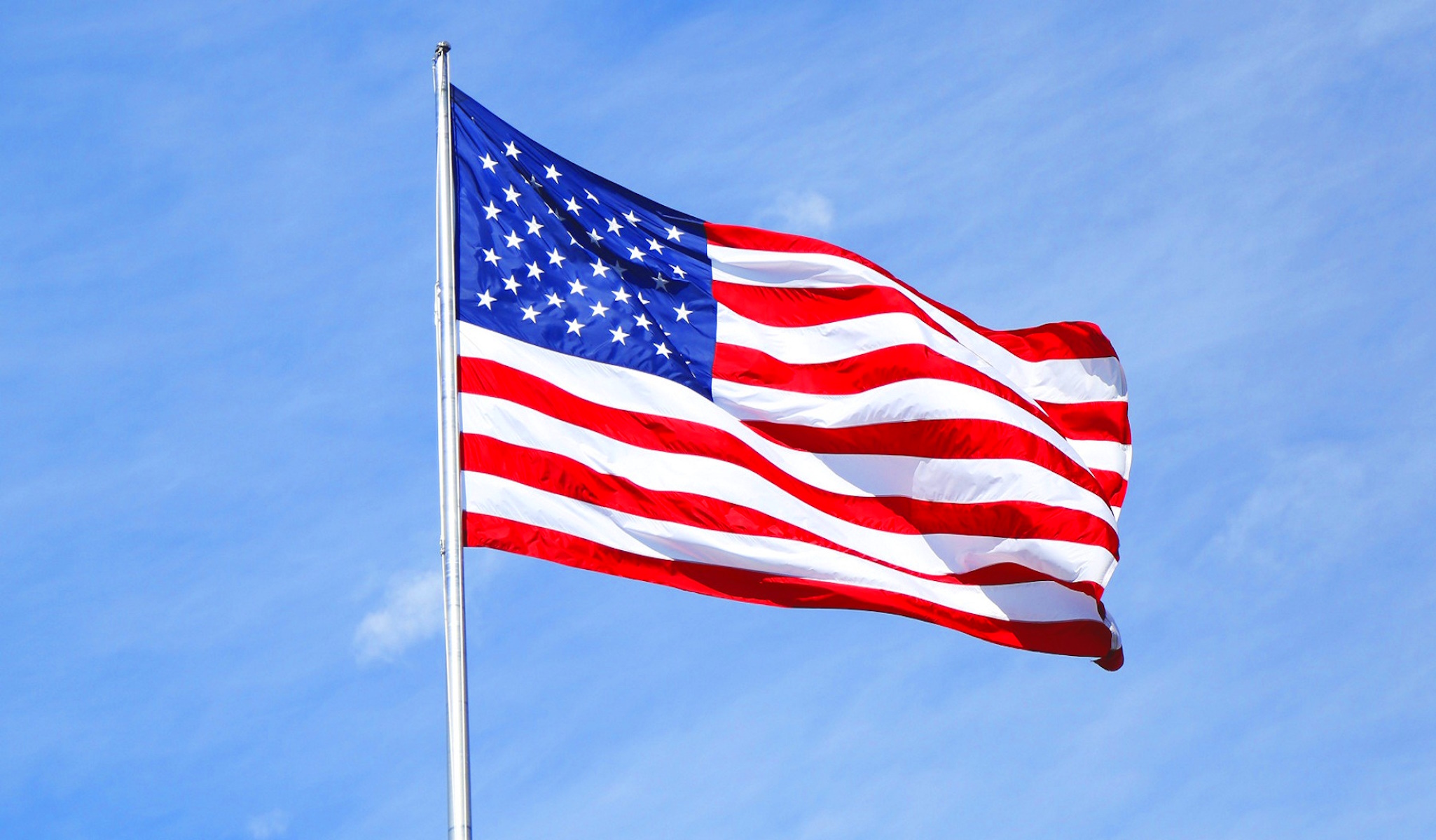 A vibrant image of the American flag billowing in the wind