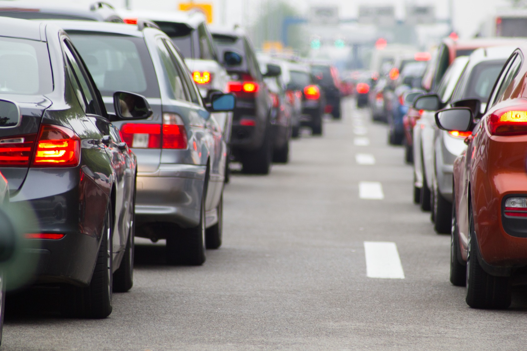 A road crowded with cars waiting in traffic